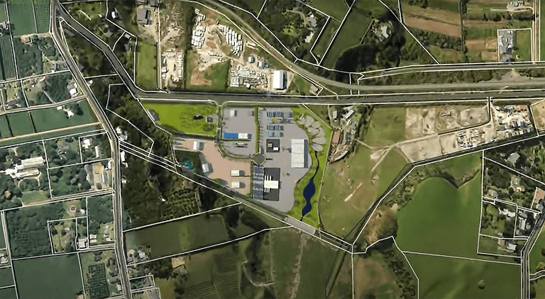 Aerial view of Te Puna Business Park with the site boundary and lot layout overlaid on the surrounding rural land