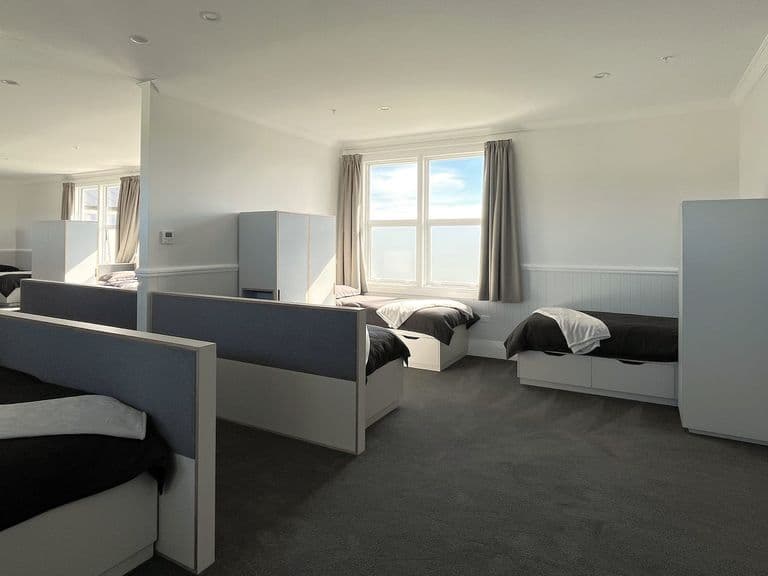 A refurbished dormitory inside the St Joseph’s Māori Girls’ College hostel, with new beds, joinery and carpet